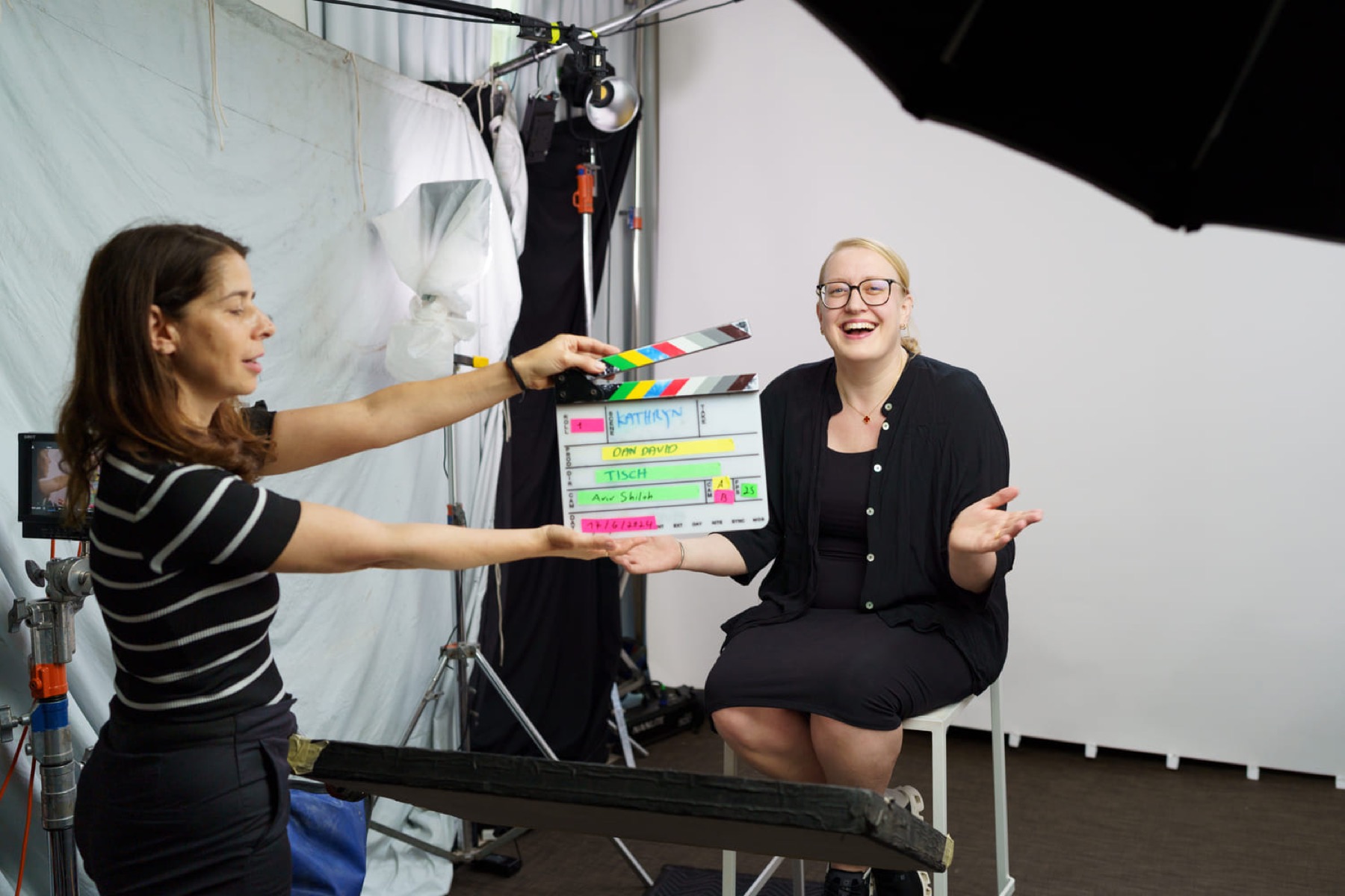 A clapperboard held up in a studio before a laureate interview, marked Dan David, Tisch, and the date