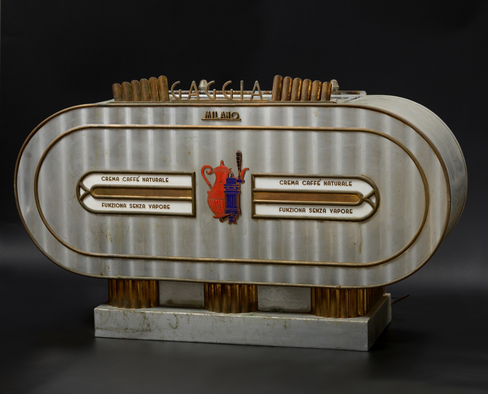 A chrome and brass Gaggia Milano espresso machine, lettered crema caffe naturale funziona senza vapore